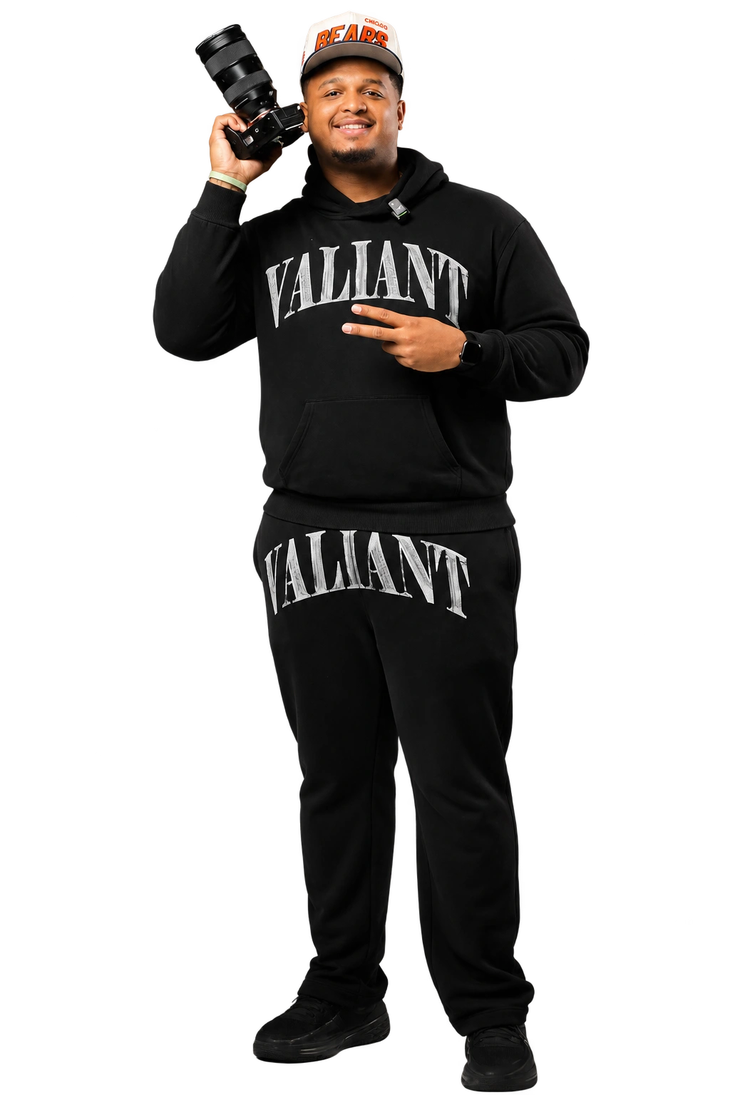 ThirdEye photographer holding a camera, wearing a Bears cap and black studio outfit
