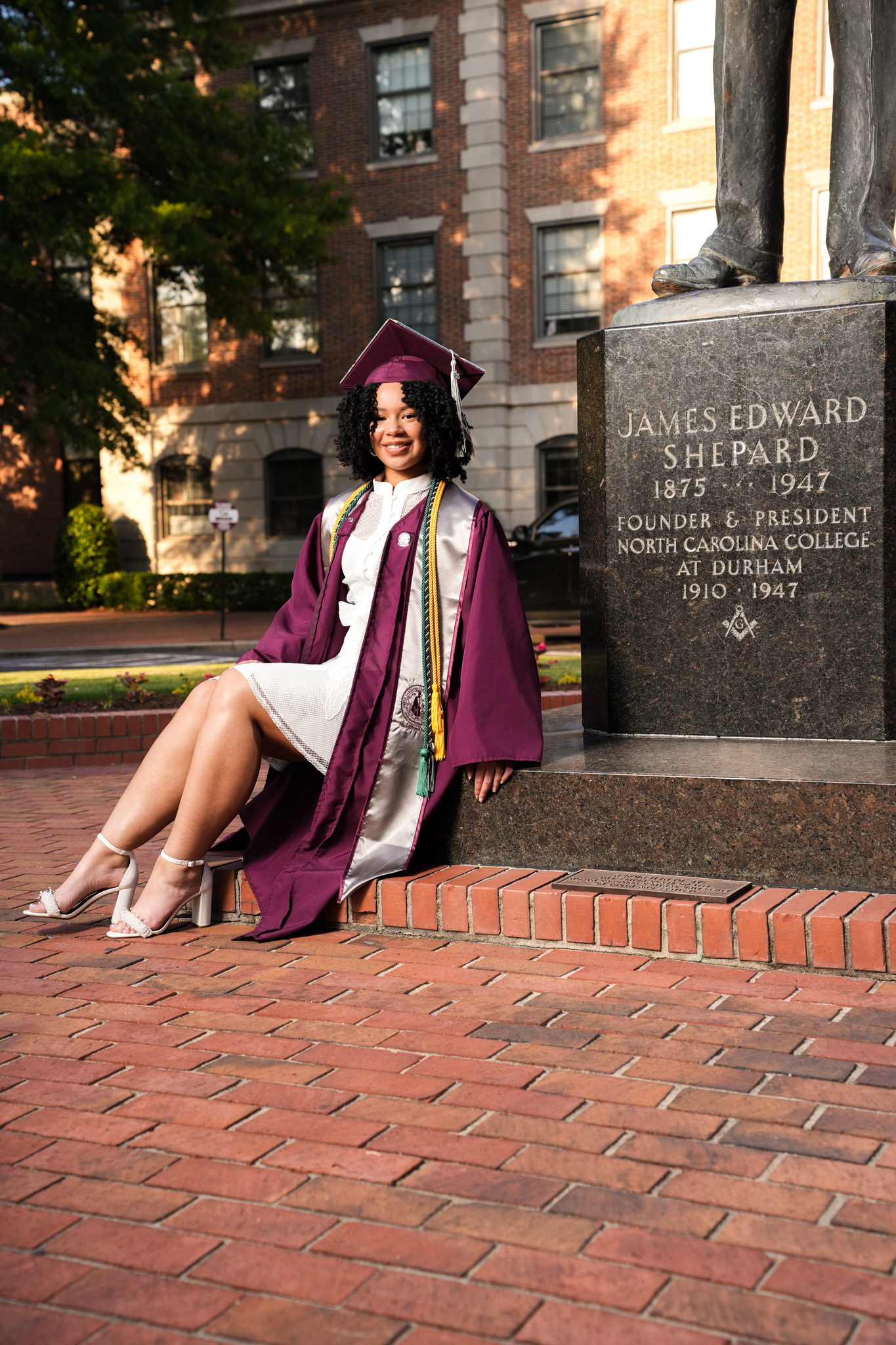 Graduate photographed outside on campus